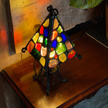 Load image into Gallery viewer, Stained glass lamp with multicolored glass pieces on a wooden surface