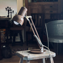 Load image into Gallery viewer, Vintage-style desk lamp on a wooden stool in a rustic room setting.