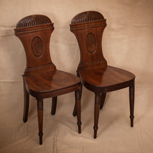 Load image into Gallery viewer, Pair of wooden chairs with intricate designs on a beige background