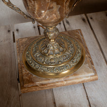 Load image into Gallery viewer, Decorative gold and marble lamp base on a wooden surface
