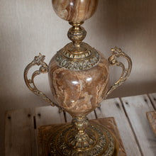 Load image into Gallery viewer, Decorative marble lamp with gold handles on a wooden table.
