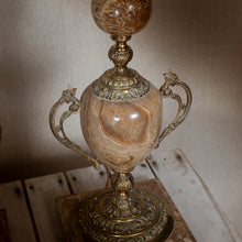 Load image into Gallery viewer, Decorative marble lamp with gold handles on a wooden table.
