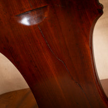 Load image into Gallery viewer, Close-up of a wooden chair with a visible crack
