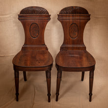 Load image into Gallery viewer, Pair of wooden chairs with intricate designs on a beige background
